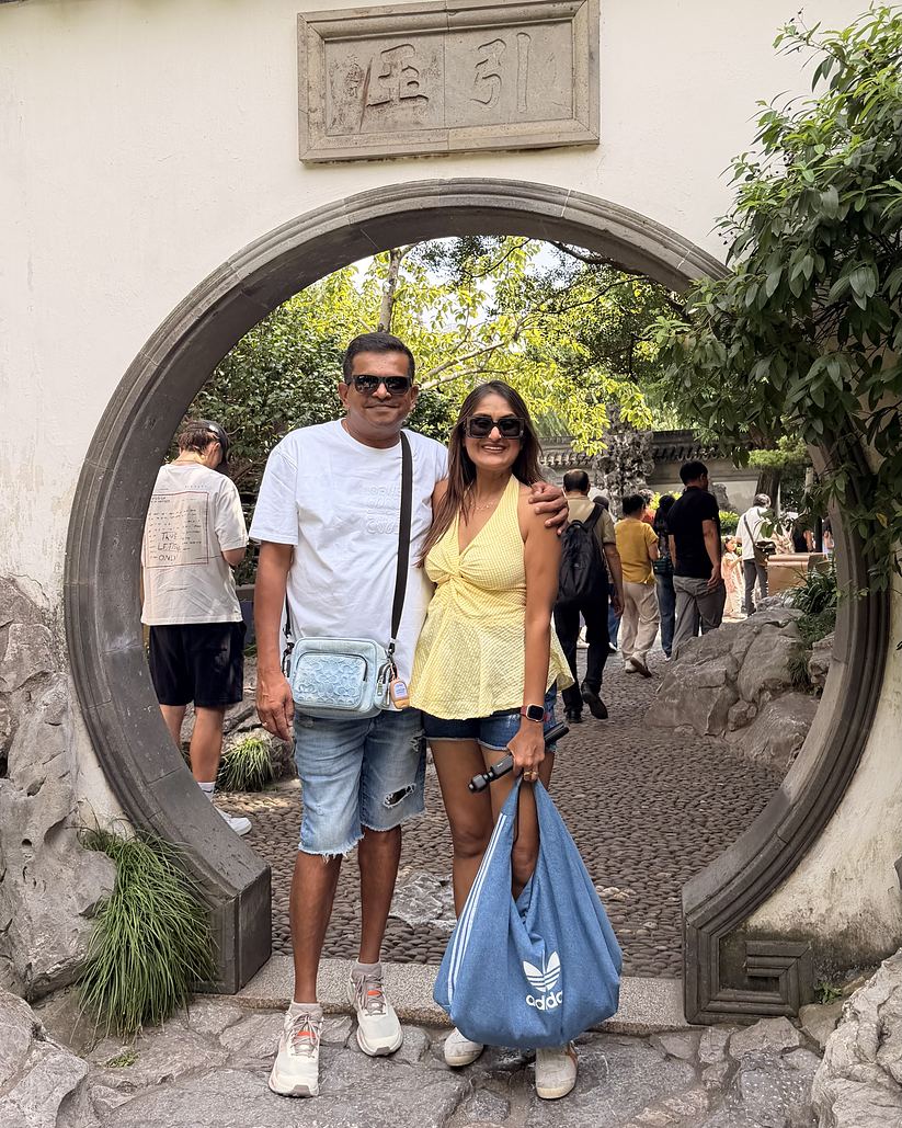 Rinnku & Ritesh at a moon gate in Shanghai